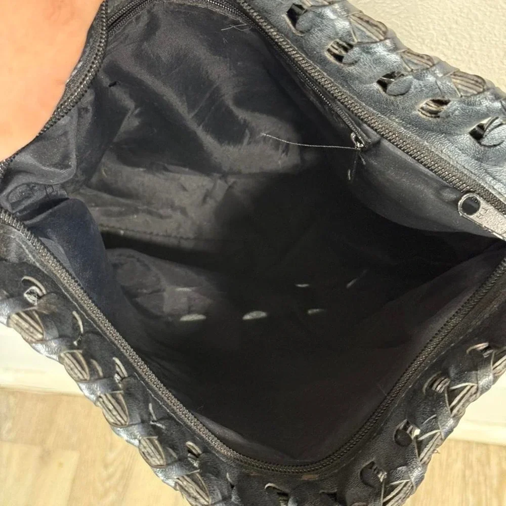 Black woven leather shoulder bag with strap